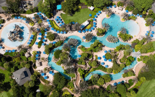 aerial view of property and water park pool